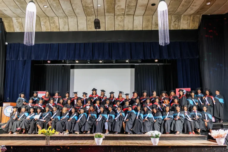 Graduates seated on stage